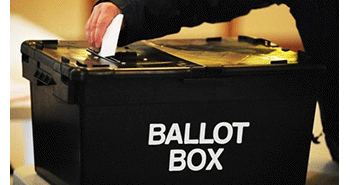 Vote being put into a ballot box