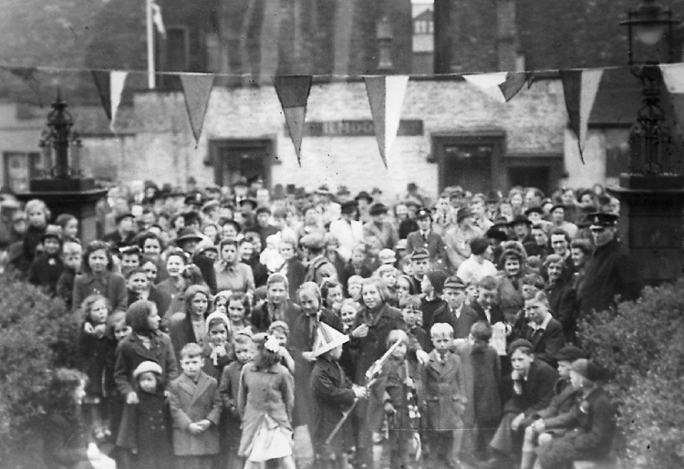 Reverent Tom Cross's VE Day image of a portion of the crowd outside Penrith Town Hall