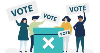 Four people stood around a green ballot box holding up vote banners